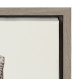 Close-up of a neutral gray wooden frame corner surrounding an off-white canvas with a small portion of a ram's horn in muted brown and gray tones visible at the edge.