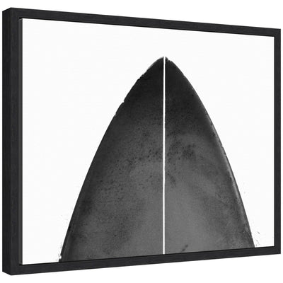 Abstract minimalist coastal black surfboard framed canvas art by Saint and Sailor Studios, shown hung on a wall