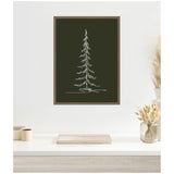 Minimalist white line drawing of a tall evergreen tree on a deep green rectangular canvas with a simple wooden frame, hanging above a white desk with neutral decor.