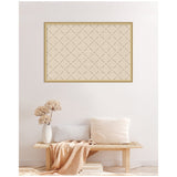 Rectangular beige lattice print with small black dots in a diagonal grid, framed in light wood, hanging above a minimal wooden bench with neutral pillows and a textured vase.