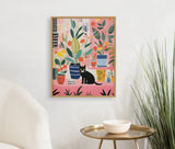Colorful painting of various potted houseplants with patterned pots and a black cat sitting among them on a pink background, framed in light wood against a white wall.