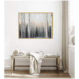 Framed canvas painting of a misty birch forest in muted grays and soft whites hanging above a wooden bench draped with neutral-toned textiles in a minimalist room.