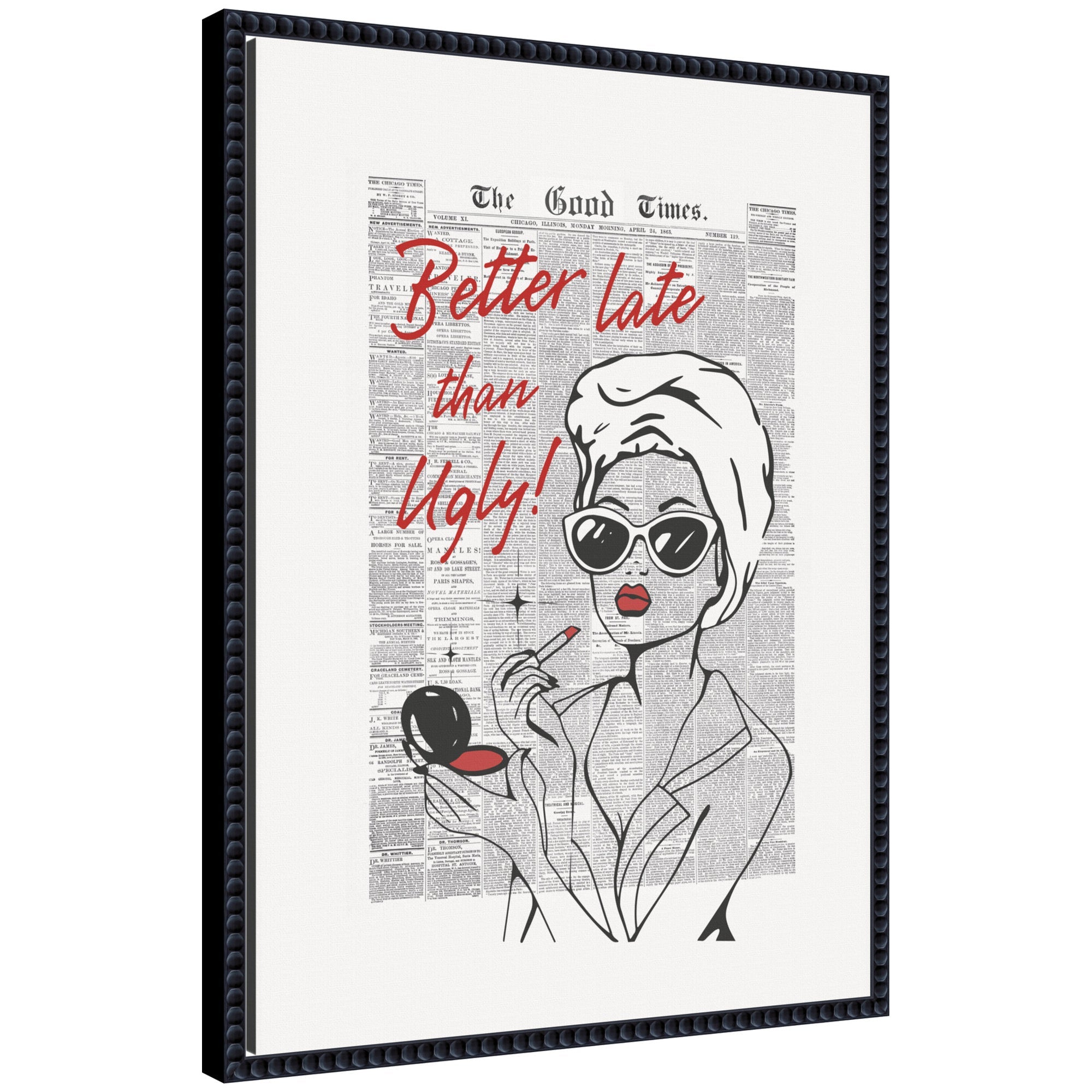 Framed canvas wall art titled 'Better Late Than Ugly Newspapers' by Honey Island Studio, showing a chic woman applying makeup over a vintage newspaper background in a black ornate frame.