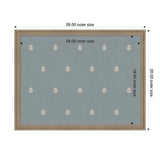Rectangular blue pinboard with small repeating white botanical motifs, framed by a light wood border, displaying dimensions of 26 by 20 inches outer and 24 by 18 inches inner.