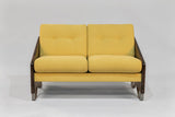 Two-seat loveseat with mustard yellow cushions and dark zebra-patterned wooden arms, featuring a compact modern design with metal-tipped legs.