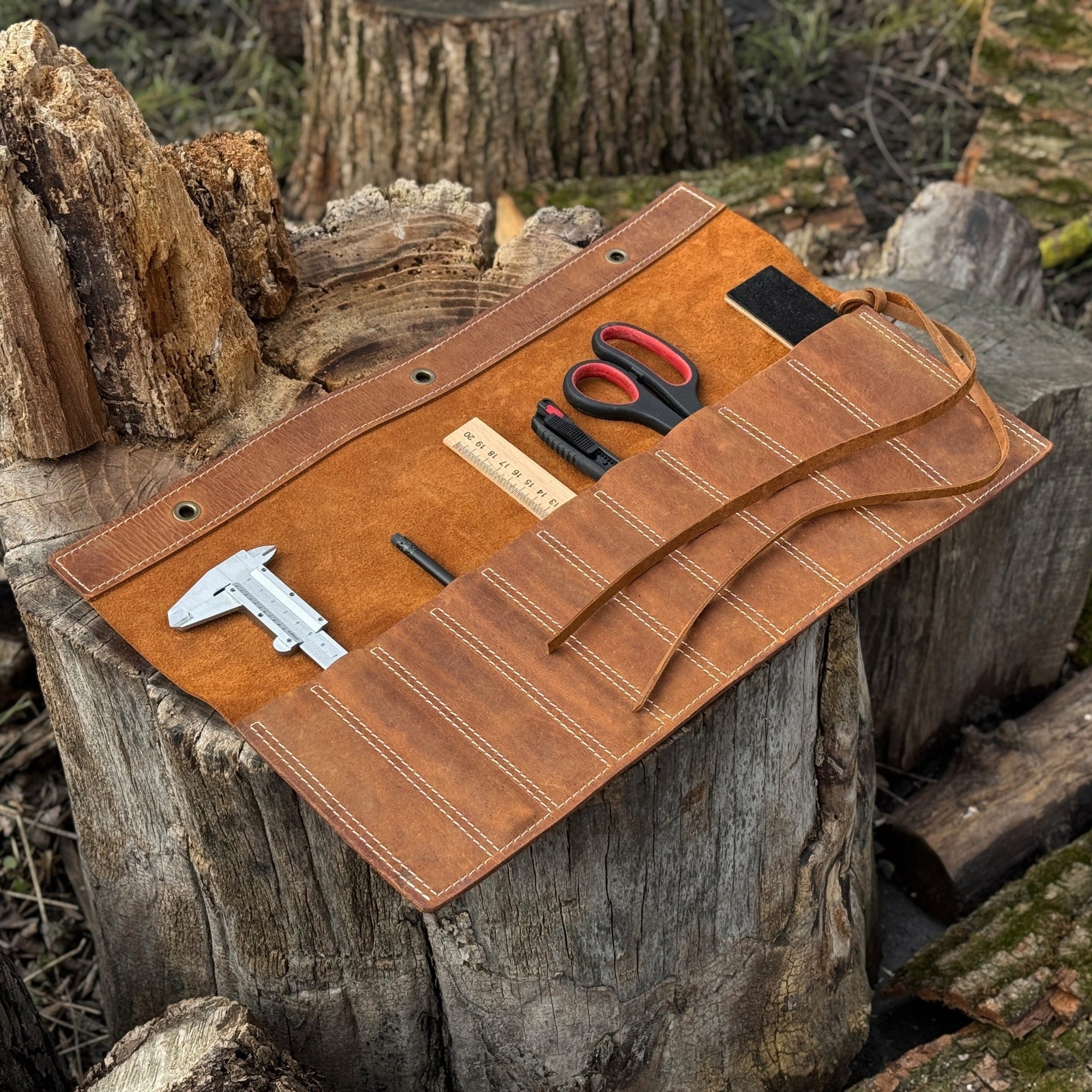 Handmade 10 Pocket Leather Chisel Roll by Sharky Forged Steel Tools showing rugged Crazy Horse leather with tools inside