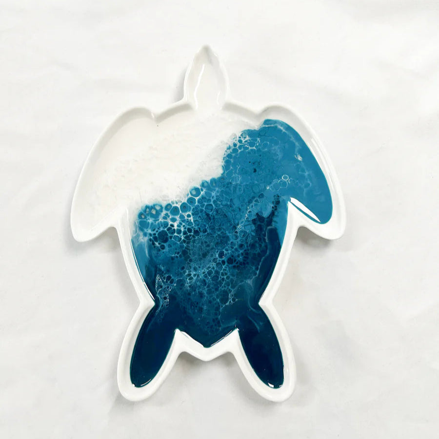resin ceramic turtle tray with blue and white design on a white background