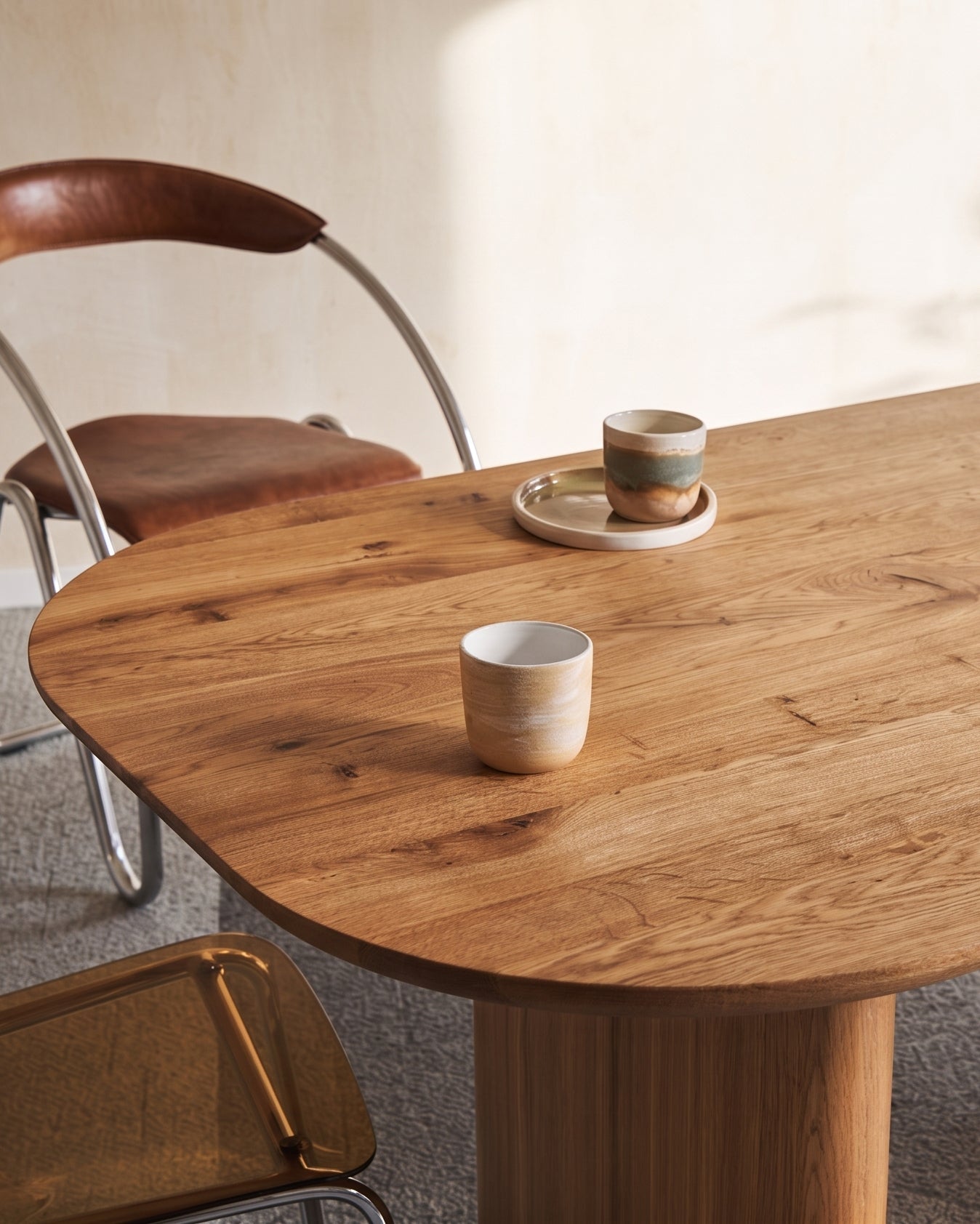 Oval solid wood dining table with chestnut wood finish and custom solid wood legs