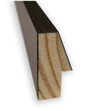 Close-up of a dark brown rectangular wooden molding with a notched L-shape edge, showing natural wood grain on the cut cross-section against a white background.
