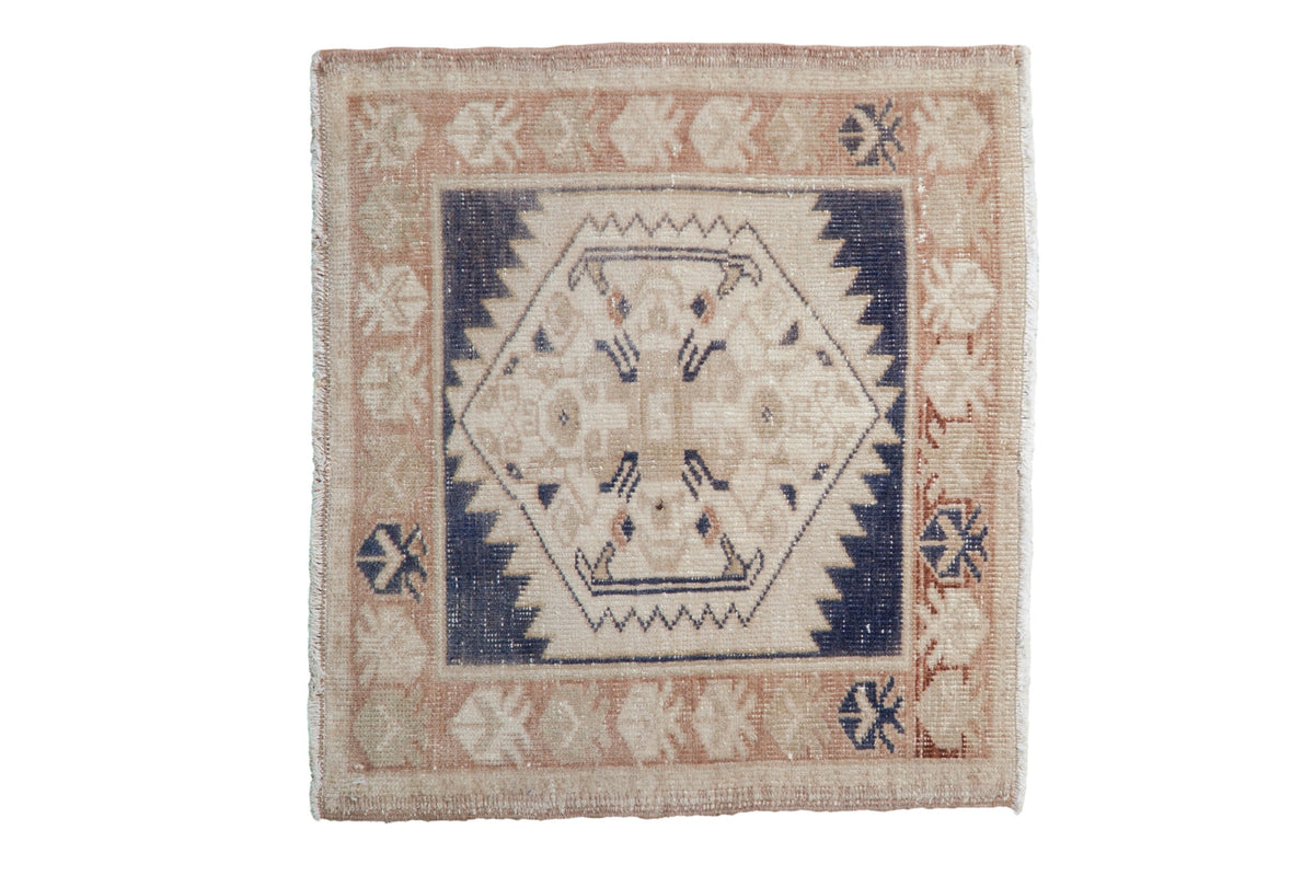 2x2 Vintage Distressed Oushak Square Rug Mat showing center medallion and distressed pattern in soft neutrals and dusty navy blue