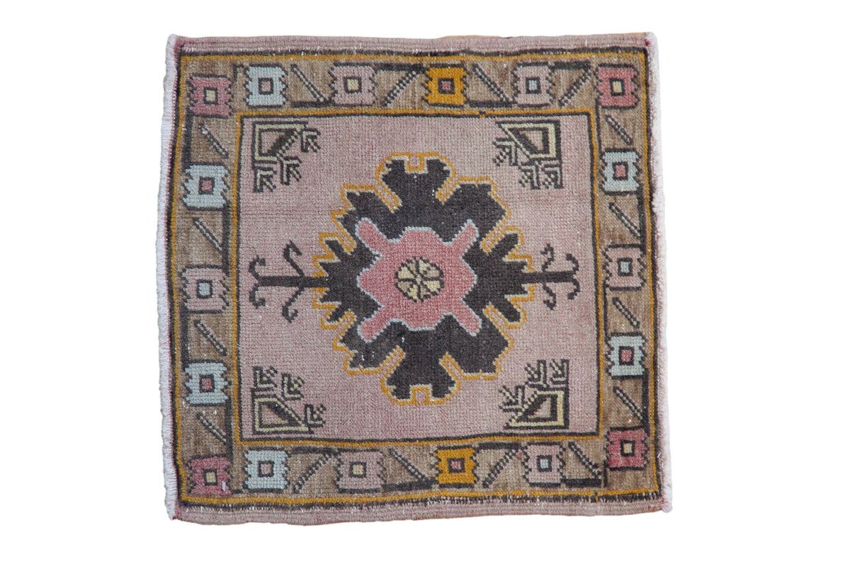 1.5x1.5 Vintage Distressed Oushak Square Rug Mat showing faded mauve and gold geometric floral patterns with arrowed corner spandrels