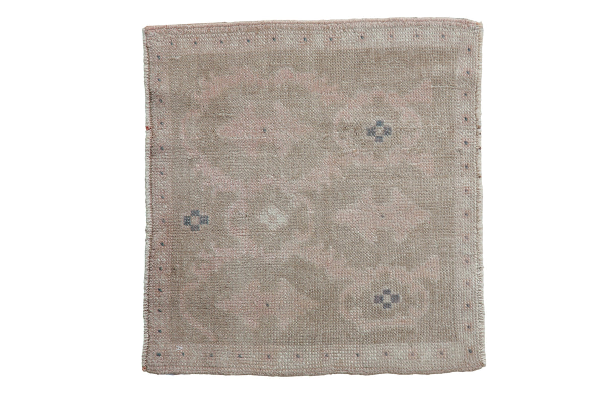 Vintage distressed Oushak square rug mat in soft ivory, sage green, and dusty blue with floral and leaf motifs