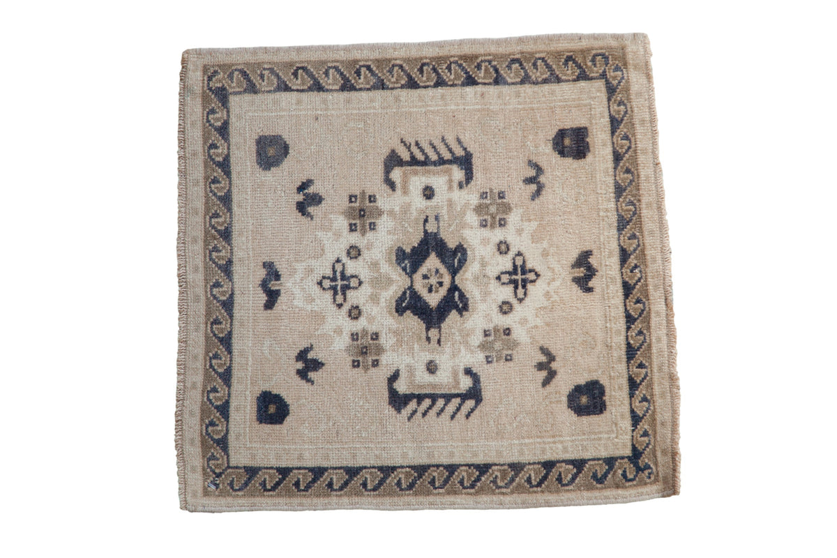 2x2 Vintage Distressed Oushak Square Rug Mat showing faded medallion and floral pattern in antique ivory and dusty navy blue colors
