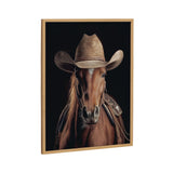 Portrait of a brown horse wearing a worn tan cowboy hat and a leather saddle against a black background, framed in light wood.