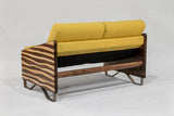 Loveseat with bright yellow cushions and dark wooden zebra-striped armrests, supported by metal legs and a wooden crossbar, shown from the back on a neutral background.