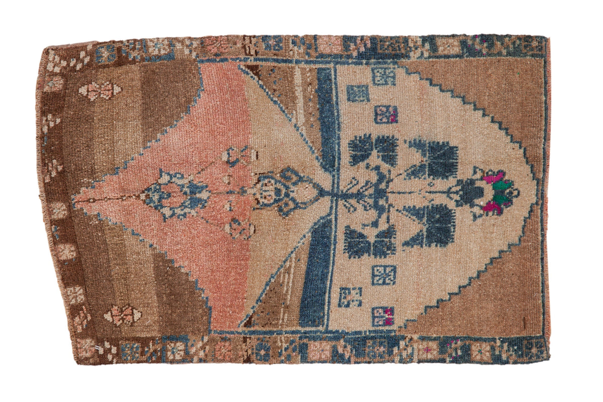 Vintage distressed Kars rug in shades of coffee brown, dusty sapphire blue, ivory and dusty rose, displaying tree of life design with fine floral details