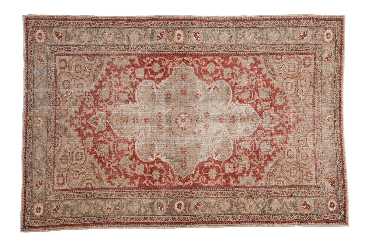 4x6 Vintage Distressed Anatolian Rug displaying worn intricate center medallion and faded multicolor floral patterns