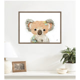 Framed canvas wall art print of a stylized koala with textured ears and soft brown shades, accented by small colorful floral details on a white background.