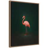 Framed canvas print of a pink flamingo standing sideways against a rich dark green backdrop, with detailed feathers and slender legs highlighted.
