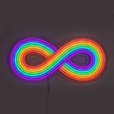 Infinity symbol shaped LED light featuring bright rainbow colors against a dark background, with a visible power cord hanging below.
