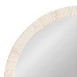 Close-up of a round wall mirror with a textured off-white frame featuring vertical, uneven ridges for a natural, sculpted look.