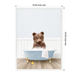 Young brown bear cub sitting in a light blue clawfoot bathtub filled with bubbles, white towel draped over side, rubber duck on wooden floor, pale textured wall background.