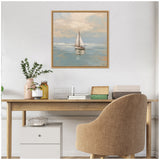 Pastel-toned painting of a sailboat on calm water with soft clouds, framed and hung above a wooden desk with a beige upholstered chair.