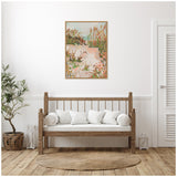 Framed pastel painting of a coastal path with grasses and flowers, displayed above a wooden bench with white cushions in a minimalist room.