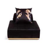 Square black pouf with a matching black cushion featuring a print of multiple hands holding red lipsticks, set against a white background.