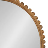 Close-up of a round mirror with a light wood frame featuring evenly spaced round wooden knobs along its edge against a white background.