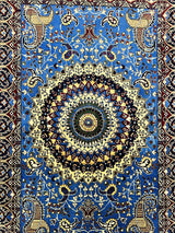 Rectangular hand-knotted rug with a central sunburst medallion on sky blue field, featuring intricate floral and paisley patterns in cream, navy, burgundy, and gold hues.