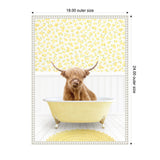 Highland cow with long shaggy hair sitting inside a pale yellow clawfoot bathtub against white wainscoting and yellow floral wallpaper, with a round yellow rug below.