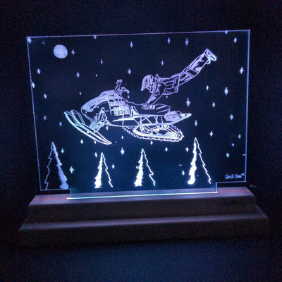 Leaping Levi Levalle laser cut clear acrylic design on a handmade LED light stand glowing with soft LED light