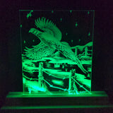 Green LED-etched acrylic panel featuring a detailed flying pheasant over a barbed-wire fence with a rural landscape and starry sky background.