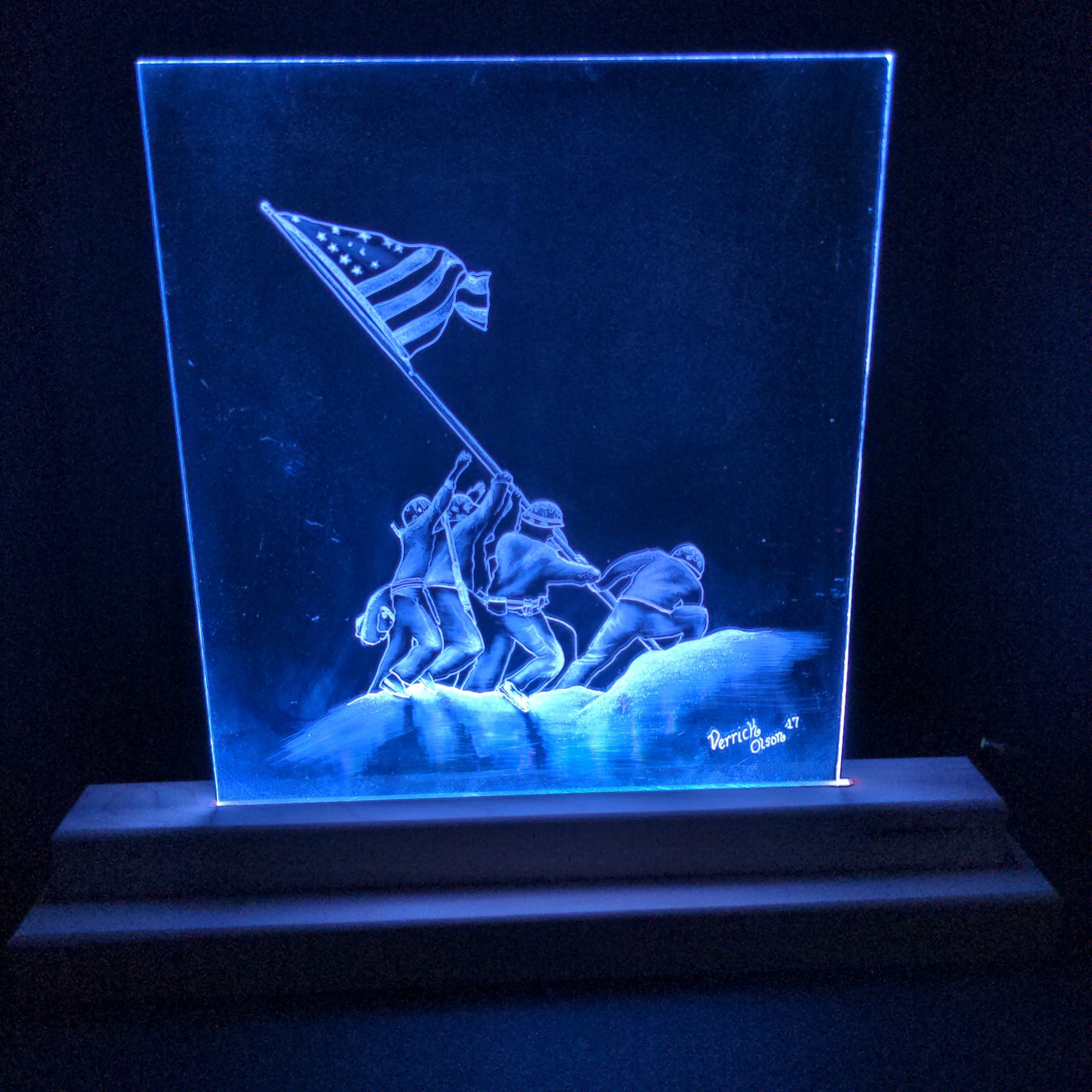 Raise the Flag standard LED light featuring laser-engraved acrylic panel seated in handmade LED light stand illuminating from base