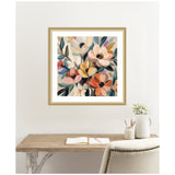 Square framed painting of an abstract bouquet with flowers in soft peach, cream, yellow, and coral tones, accented by muted green and blue leaves, hanging above a wooden desk.