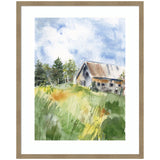 Watercolor painting of a rustic barn with a slanted roof surrounded by green and yellow fields, against a partly cloudy blue sky, framed in light wood.