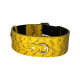 Wide mustard yellow dog collar with black snake scale pattern and a silver D-ring buckle on black inner lining.
