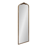 Tall rectangular mirror with an arched top, featuring a carved floral crest in dark wood frame with a warm brown finish.