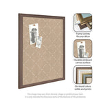 Beige pinboard with a white lattice pattern, framed in dark wood, displaying two black-and-white photos pinned with clips.