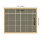 Rectangular framed fabric pinboard with a sage green plaid pattern and white grid lines, measuring 24 by 18 inches inside a light wood frame 26 by 20 inches.