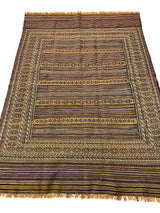 Hand-woven Afghani Maliki wool kilim rug with intricate horizontal stripes and geometric patterns in brown, tan, and black, featuring fringe on both ends.