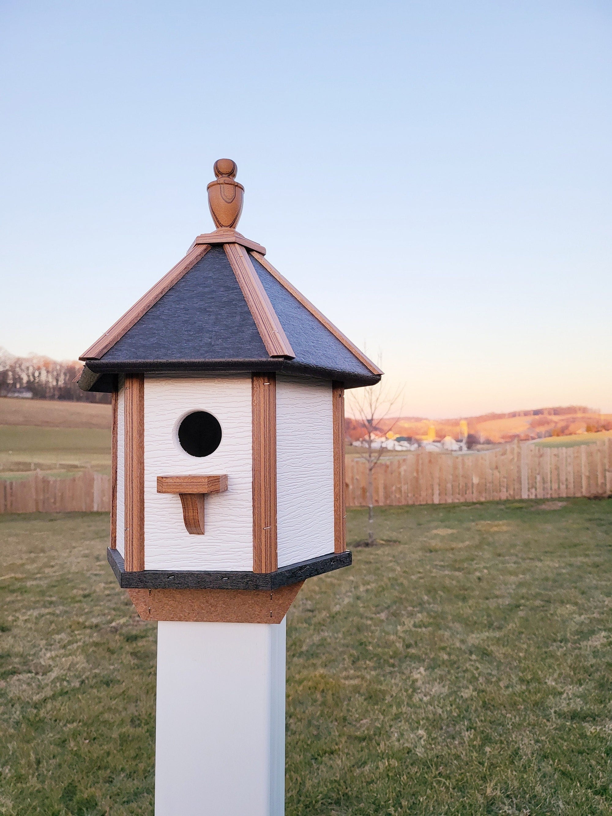 Handcrafted Amish poly birdhouse with one hole, shown mounted outdoors