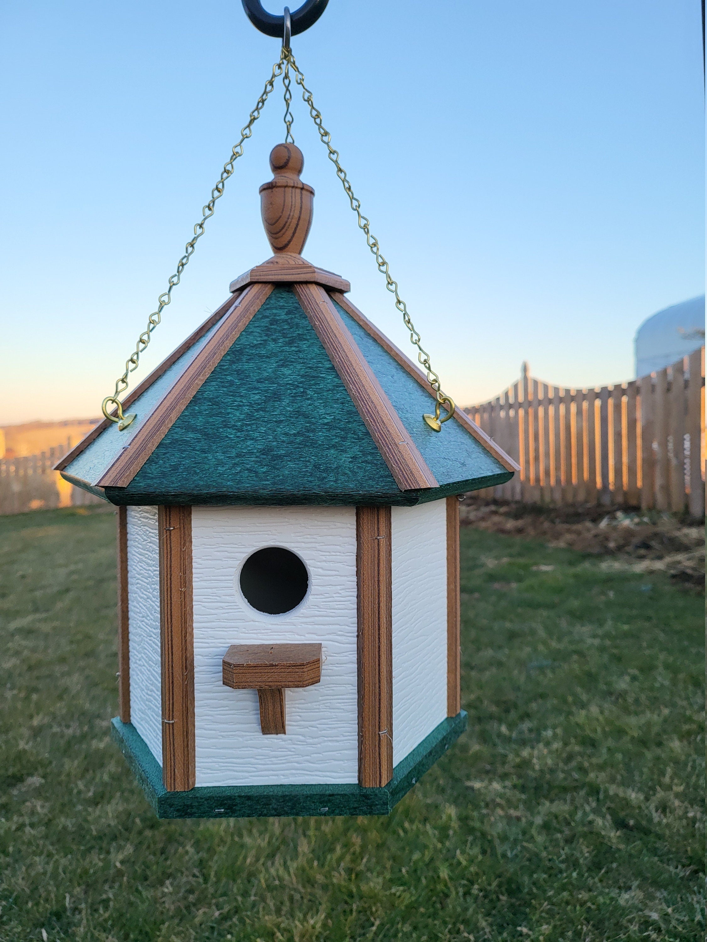 Handcrafted Amish poly birdhouse with one hole, shown mounted outdoors