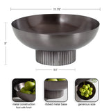 Dark metallic bowl with a wide rounded top and ribbed cylindrical base, shown with green apples inside and dimensional measurements for height and width.