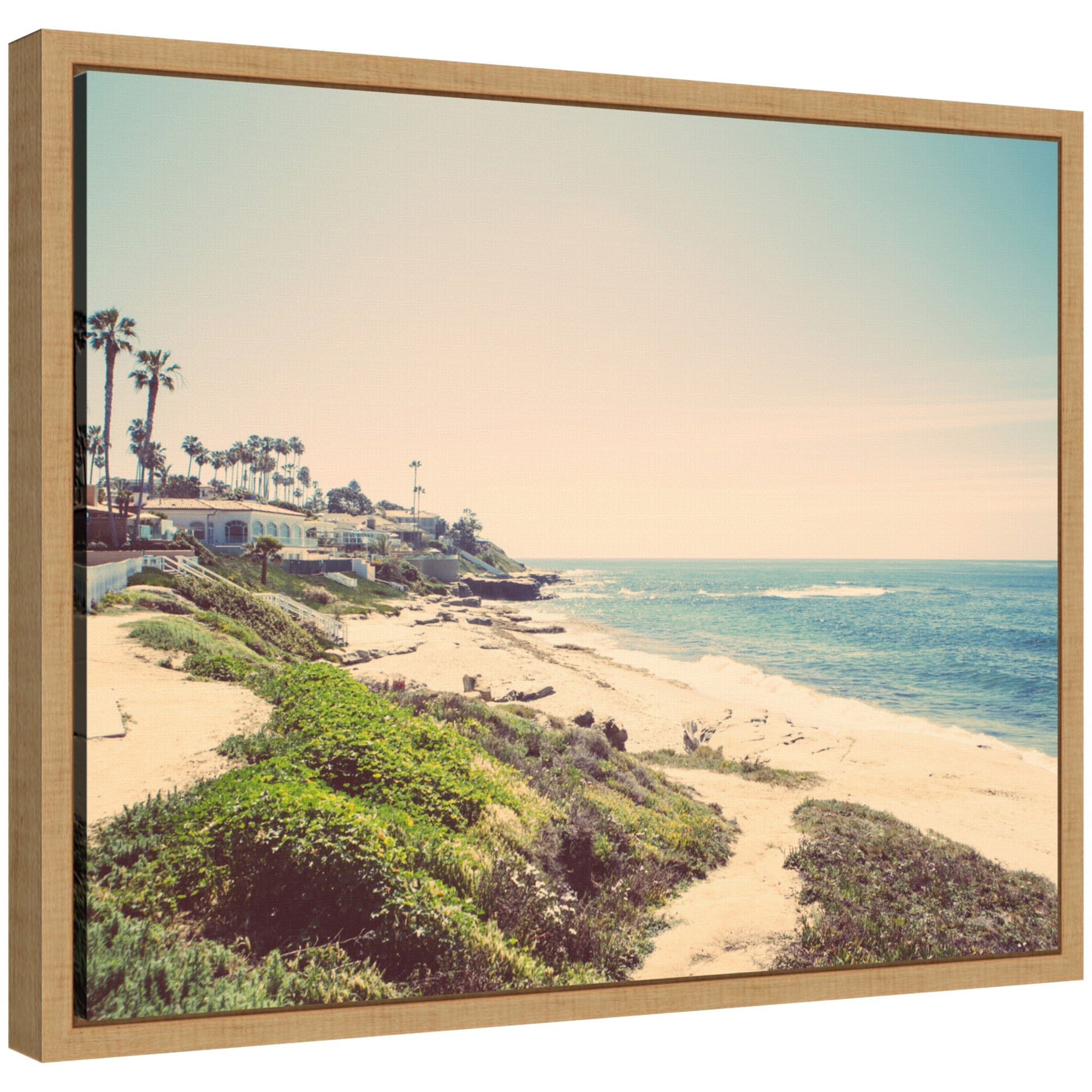 Sylvie Vintage Coastal Seaside Beach framed canvas showing a serene beach scene with muted colors and a modern floating frame.