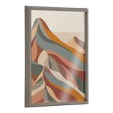 Framed printed glass artwork depicting abstract mountains with curved layers in muted orange, gray, beige, and rust tones, viewed at a slight angle.
