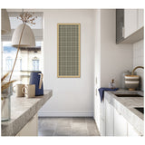 Tall rectangular sage green plaid fabric pinboard with beige grid lines framed in light wood, hanging on a white kitchen wall between countertops with gray stone surfaces.
