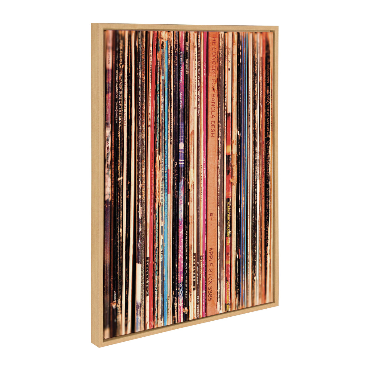 Framed canvas print depicting a vertical row of colorful vintage vinyl record spines with varying text and graphic designs, displayed at an angled view.