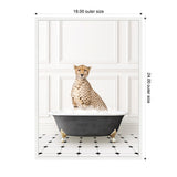 A cheetah sits upright inside a classic black clawfoot bathtub filled with white bubbles against a white paneled wall and black-and-white tiled floor.